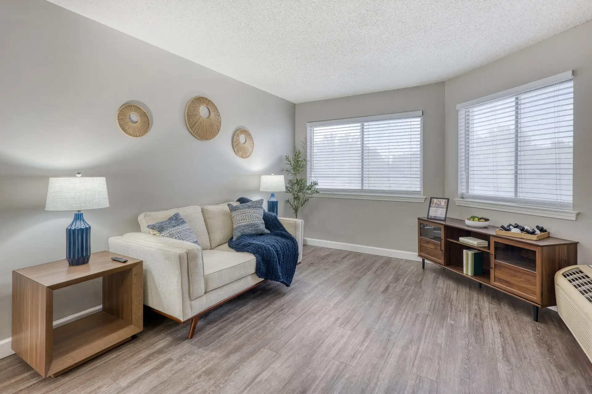 Furnished living room with lighting and decor.
